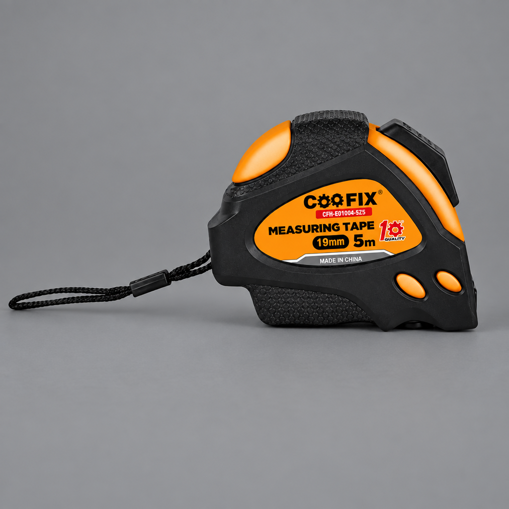Black-and-orange Coofix tape measure on grey