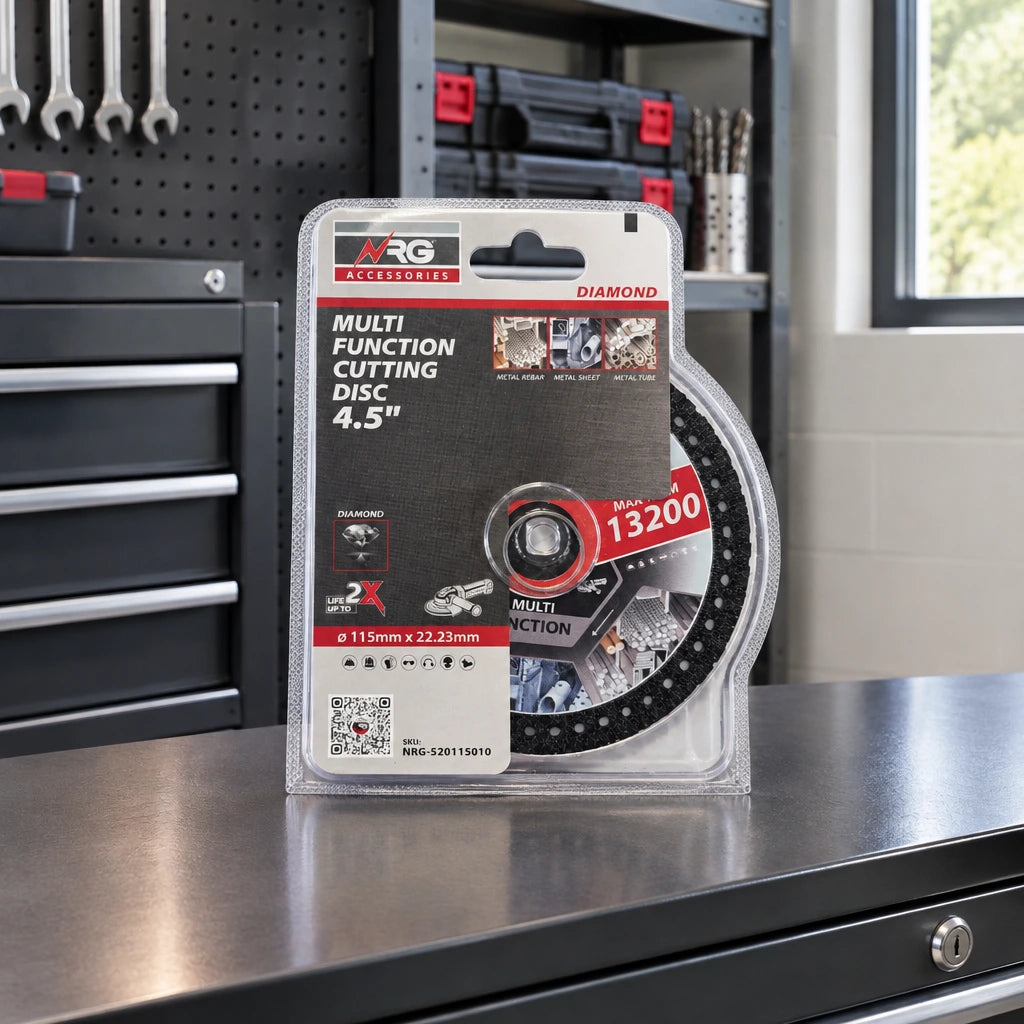 Packaged NRG diamond cutting disc resting on an organised metal-fabrication workshop tool cabinet.