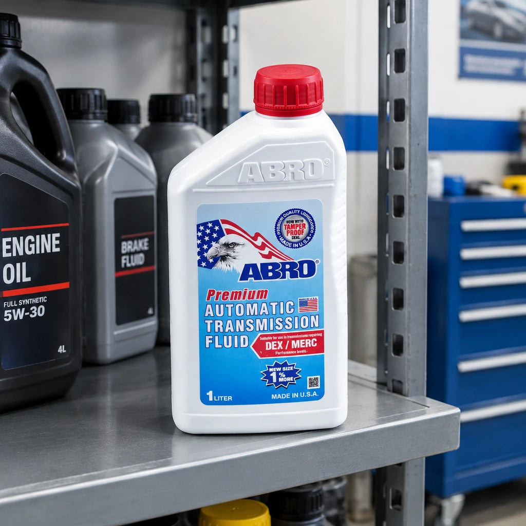 Sealed ABRO Dexron III/Mercon transmission fluid bottle stored on a professional auto-service shelf