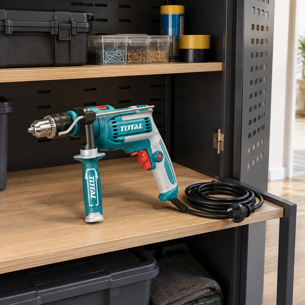 Total TG1091366 corded impact drill resting on an organised utility-room storage shelf