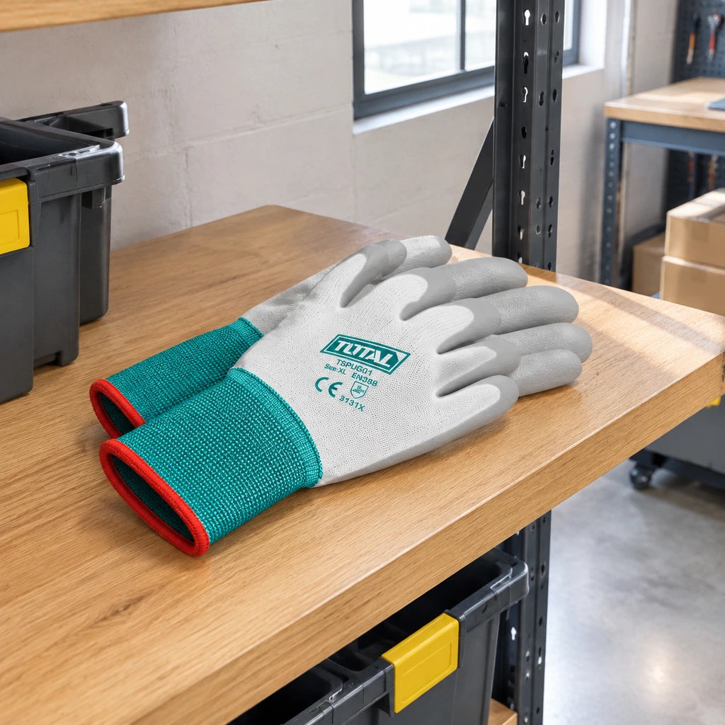 Total XL PU-coated work gloves resting on a PPE shelf in an organised warehouse receiving area