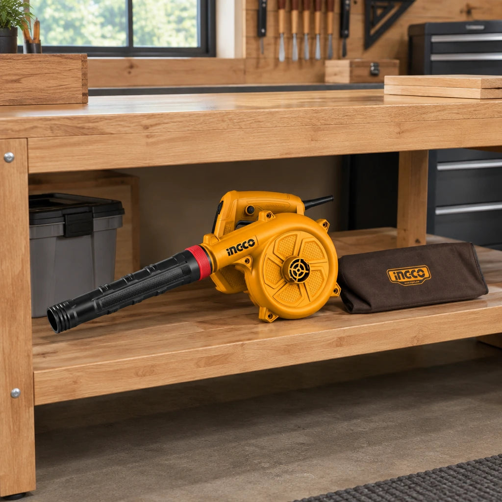 Ingco AB6508 electric blower stored on a shelf in an organised contemporary home woodworking studio.