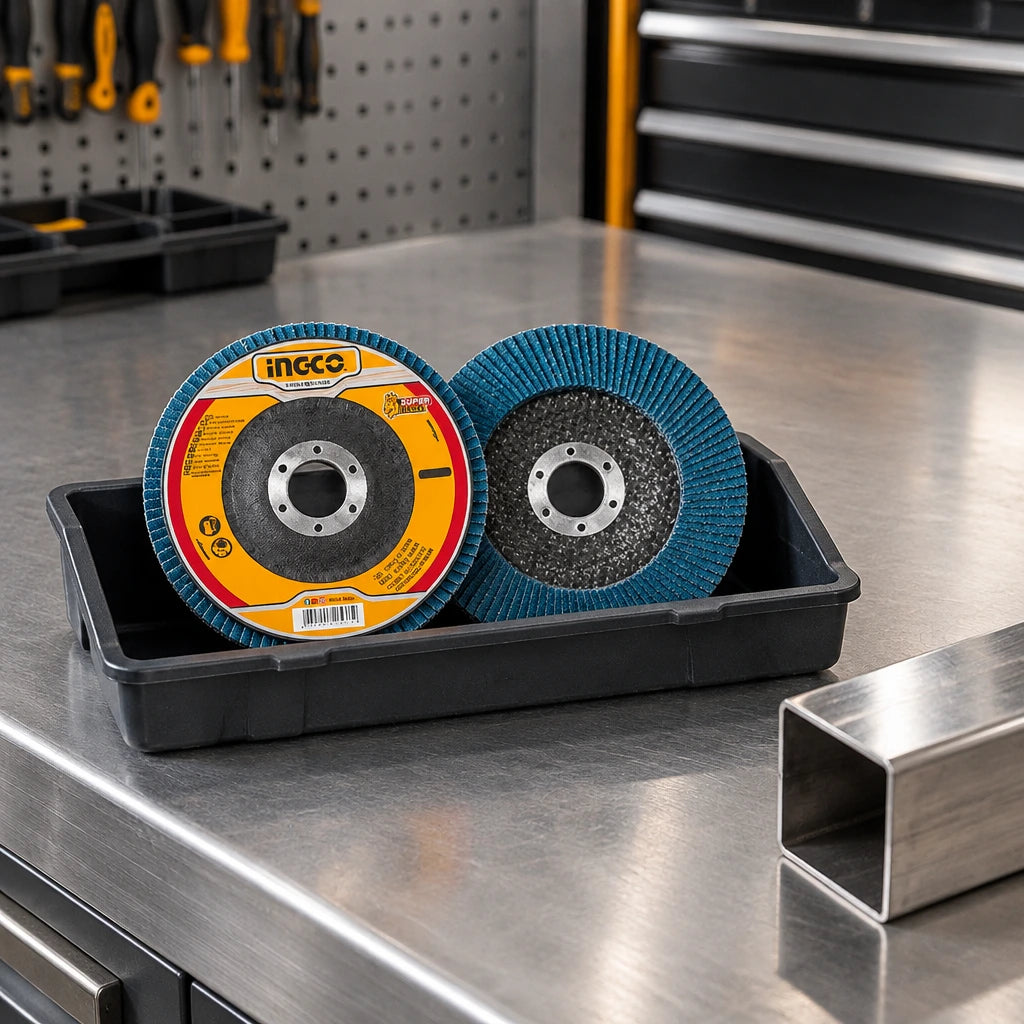 Ingco FDZ1151 blue P40 flap disc resting in an organised stainless-steel fabrication workshop
