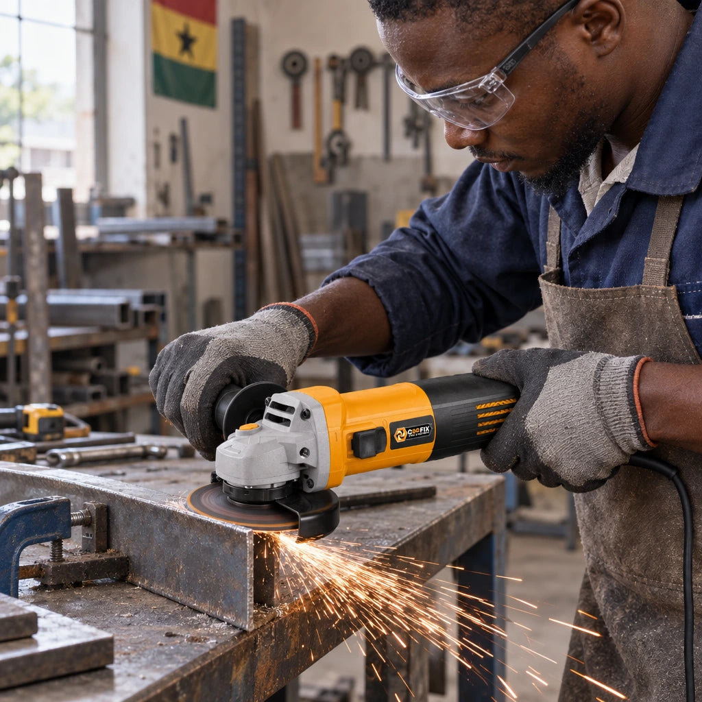 Ghanaian metalworker using a Coofix 125mm electric angle grinder to cut a steel section
