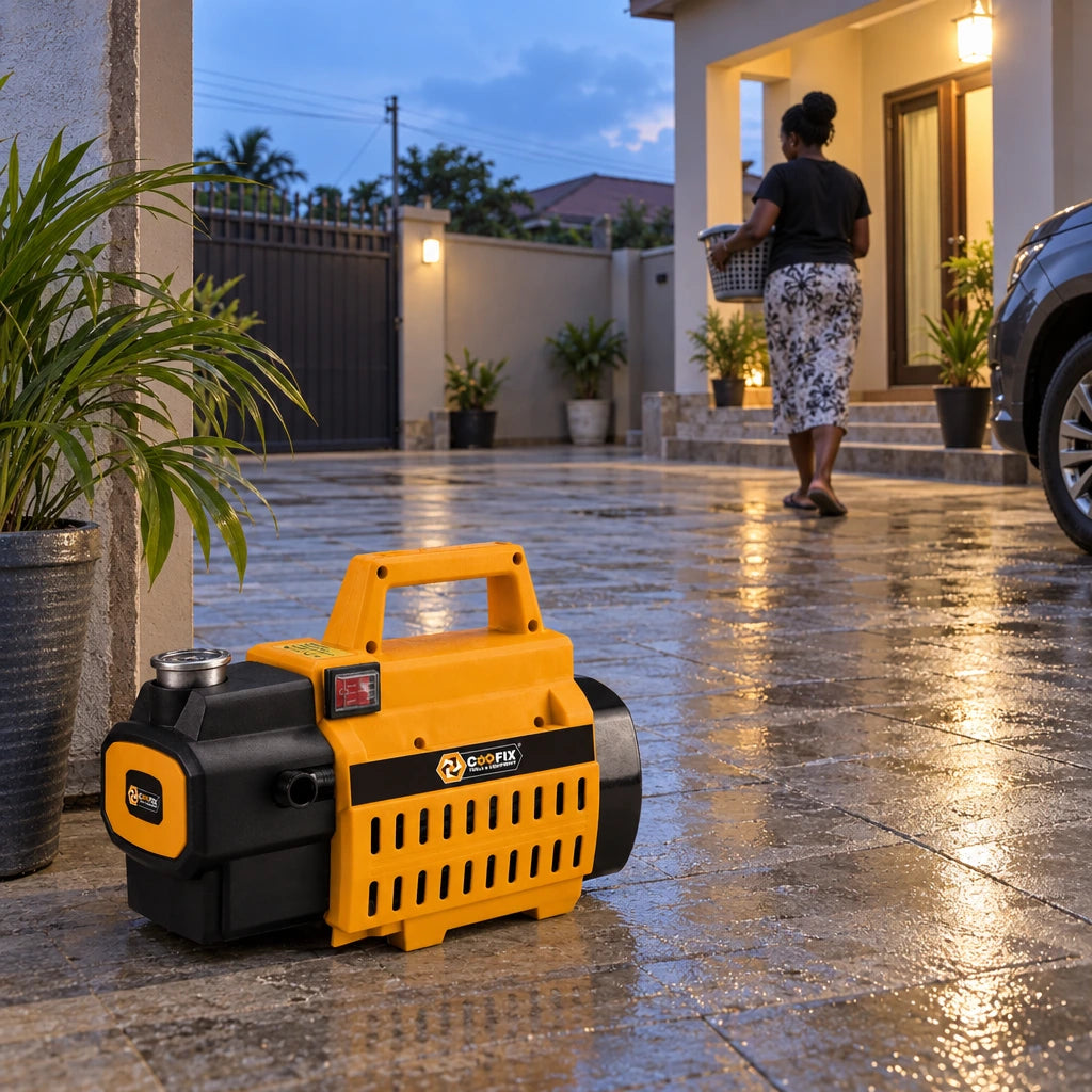 Clean residential courtyard with a Coofix pressure washer resting in the foreground