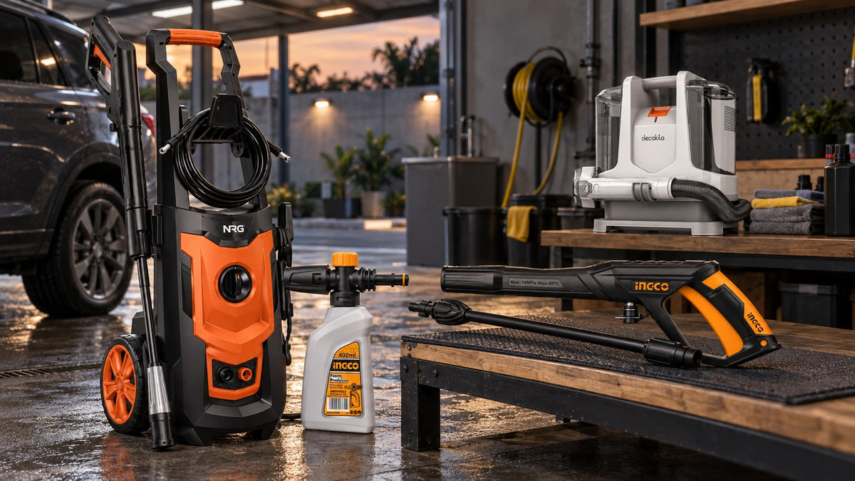 Professional pressure washer, spray gun, foam producer and spot cleaner arranged in a working garage wash bay for vehicle and exterior cleaning