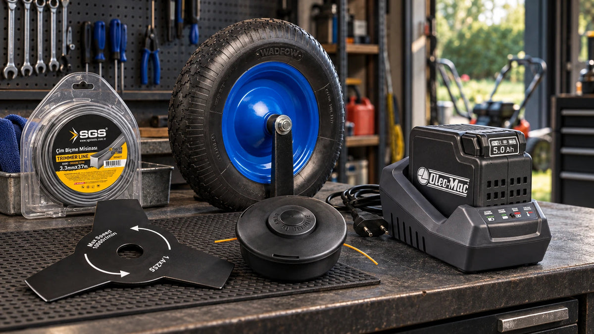 Lawn and grounds accessories arranged on a workshop bench including a brush-cutter blade, trimmer line spool and pack, wheelbarrow wheel, Oleo-Mac battery and. 
