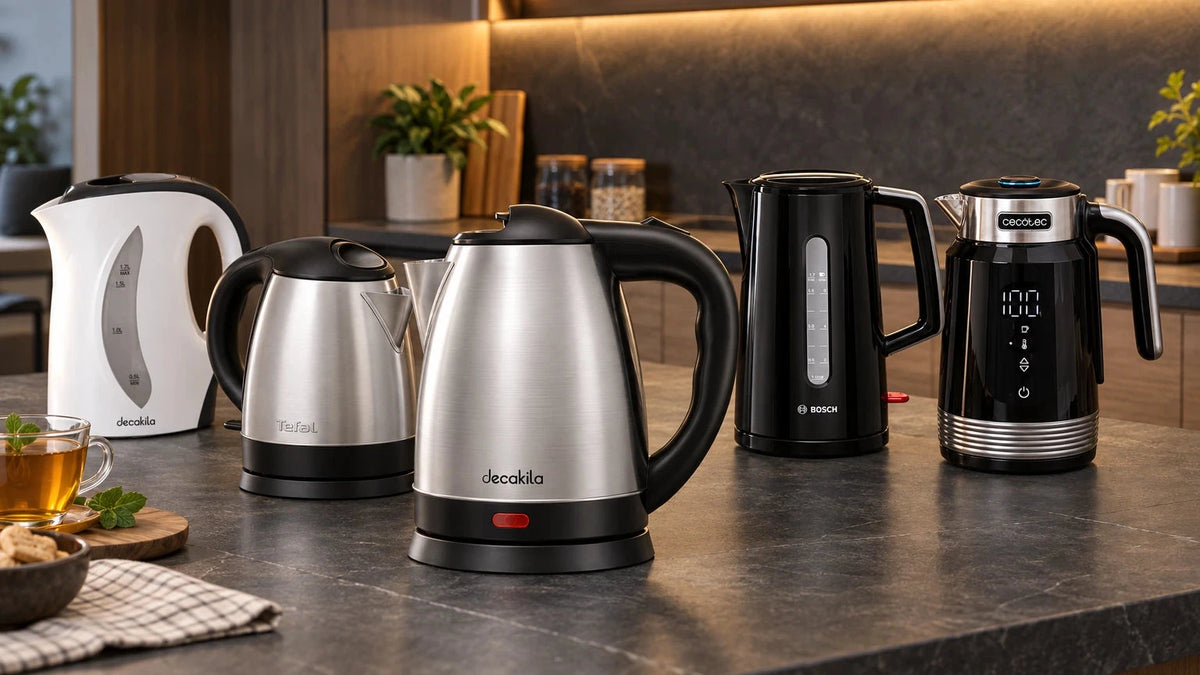 Five branded electric kettles in stainless steel, plastic, glass and digital-control designs arranged on a contemporary kitchen counter