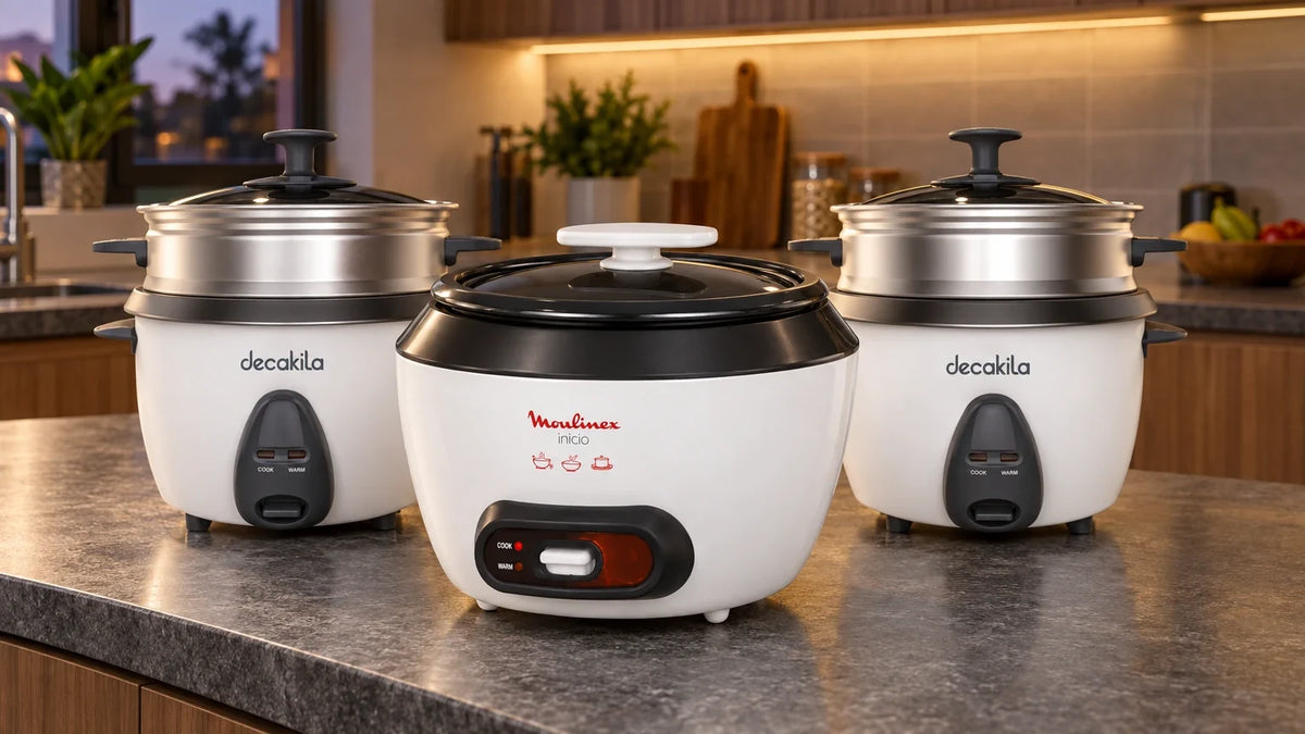 Moulinex and Decakila rice cookers arranged on a contemporary kitchen countertop, showing compact and larger household models in a warm editorial setting