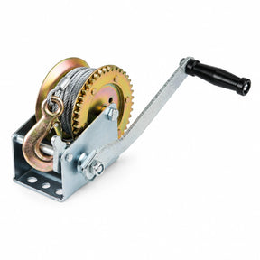 Atlas manual hand winch with wound steel cable, hook, toothed drum gear and black-grip crank on a white background.