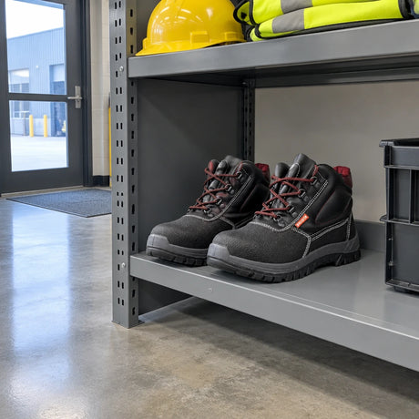 Bellota Classic S3 safety boots stored on a PPE shelf at a clean warehouse entrance