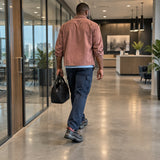 Worker wearing Bellota low-cut safety shoes walking through a completed commercial corridor