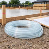 Transparent Berry PVC level hose stored beside an organised residential foundation layout