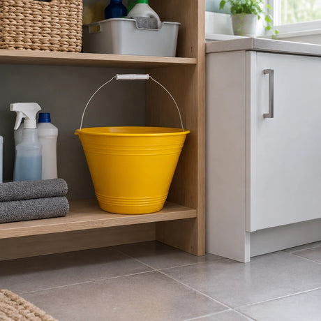 Yellow Greenline 8L utility bucket stored on a shelf in a contemporary home utility room.