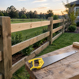 Completed timber fence repair with a Bwin manual handsaw resting on a nearby workbench