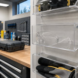 Climax CLI-590-I clear safety glasses resting in a PPE storage compartment in an organised maintenance room
