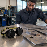 Finished gas-cut steel pieces with Climax CLI-80 welding goggles resting beside them on an inspection bench