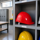 Climax Tirreno TXR safety helmet resting in an organised construction-site PPE storage room