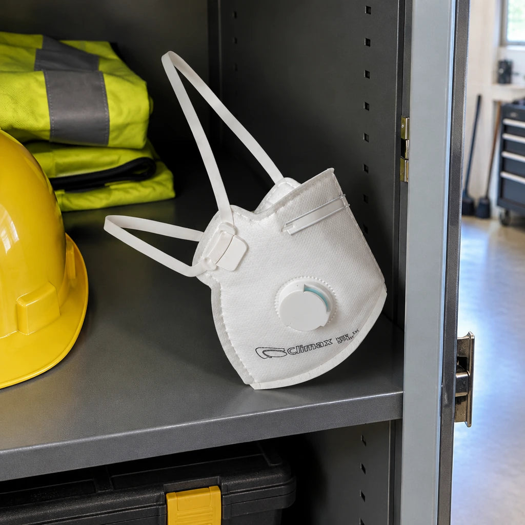 Climax valved FFP2 disposable respirator resting in a clean PPE storage compartment