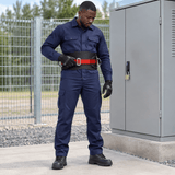 Black maintenance technician checking the belt at ground level