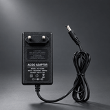 AC/DC adapter on a cinematic grey background