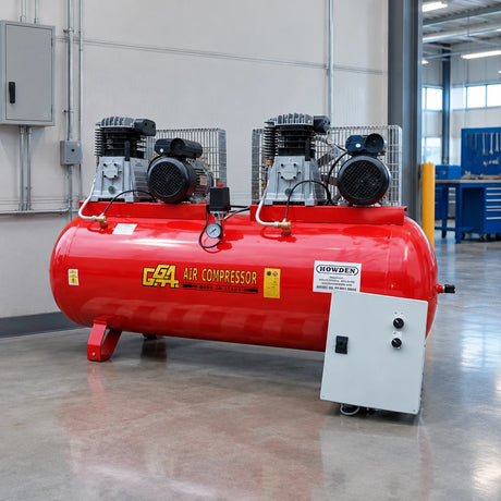 GGA LT1000 red industrial air compressor resting in an organised manufacturing utility room beside a production workshop.