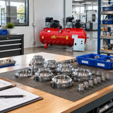 Clean machined components ready for inspection with the GGA LT1000 industrial air compressor visible in the adjoining production area.