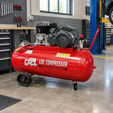 GGA 270L air compressor parked beside an organised automotive workshop service bay