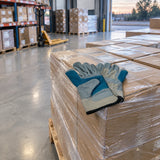 Completed carton pallet ready for dispatch with Irona leather work gloves resting on the edge.