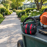 Clean botanical garden path after leaf clearing with the Irona black and red safety earmuff resting on a grounds cart.