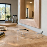 Prepared wooden trim fitted in a contemporary interior with Irona clear safety goggles resting on the nearby workbench