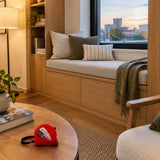 Finished fitted upholstered window seat with a closed red Kyoto tape measure nearby