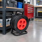 Major four-socket extension cable reel stored fully wound on its frame in an organised maintenance workshop