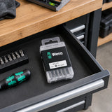 Closed Wera PH2 screwdriver bit set stored in an organised accessory drawer at a professional assembly bench.