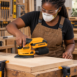 Black carpenter using the Coofix cordless sander
