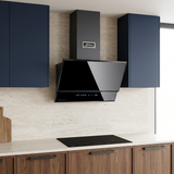 Black Kaiser Avantgarde Pro hood installed in a navy and walnut kitchen
