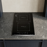 Black Kaiser ceramic hob installed in a compact kitchen