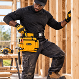 Black professional carpenter wearing and using the Coofix tool belt
