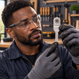 Black professional technician assessing the straight narrow silver blade