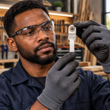 Black professional technician assessing the tapered narrow silver blade