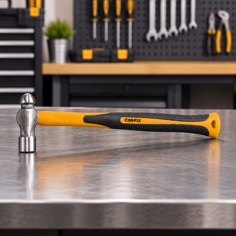 Coofix ball-peen hammer on a workshop table