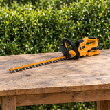 Coofix hedge trimmer on a garden worktable