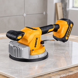 Coofix tile vibrator resting on a tile sample