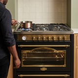 Face-hidden cooking scene using the black Kaiser Empire range