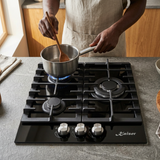 Face-hidden cooking scene using the Kaiser three-burner black gas hob