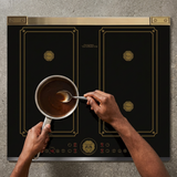 Face-hidden sauce preparation on the black Kaiser Art Deco induction hob