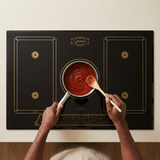 Face-hidden sauce preparation on the black Kaiser Empire induction hob