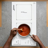 Face-hidden sauce preparation on the white Domino induction hob