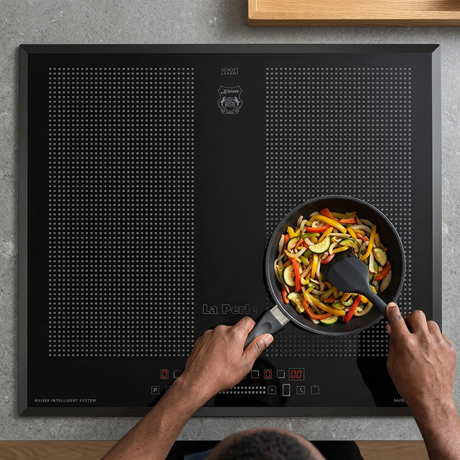 Face-hidden vegetable preparation on the black Kaiser La Perle induction hob