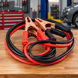 Heavy-duty jumper cables on an automotive workbench